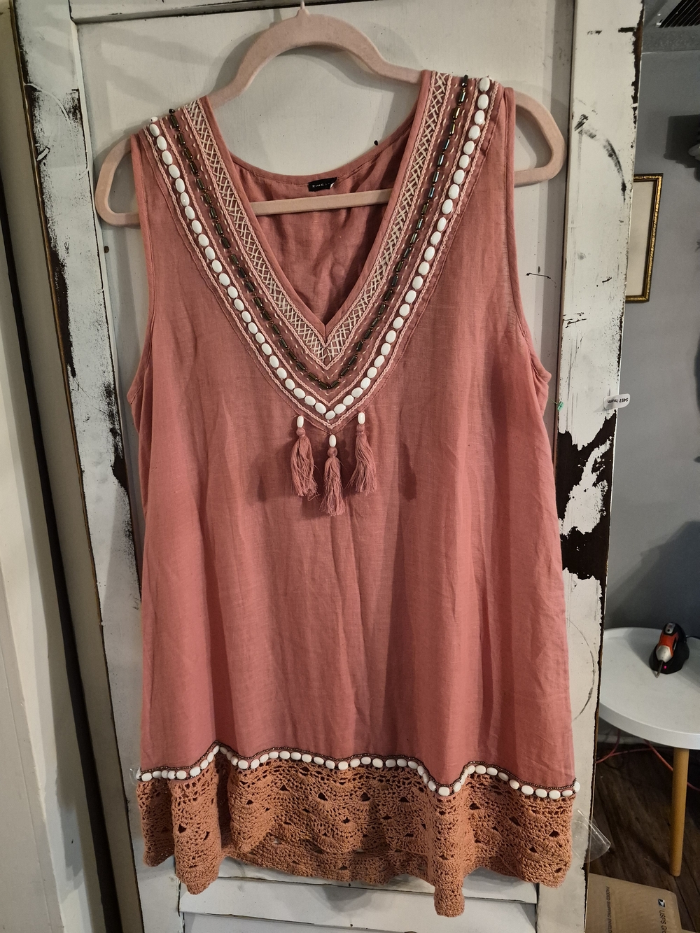 bohemian-style Zingara coral pink tunic top. It is crafted from a lightweight